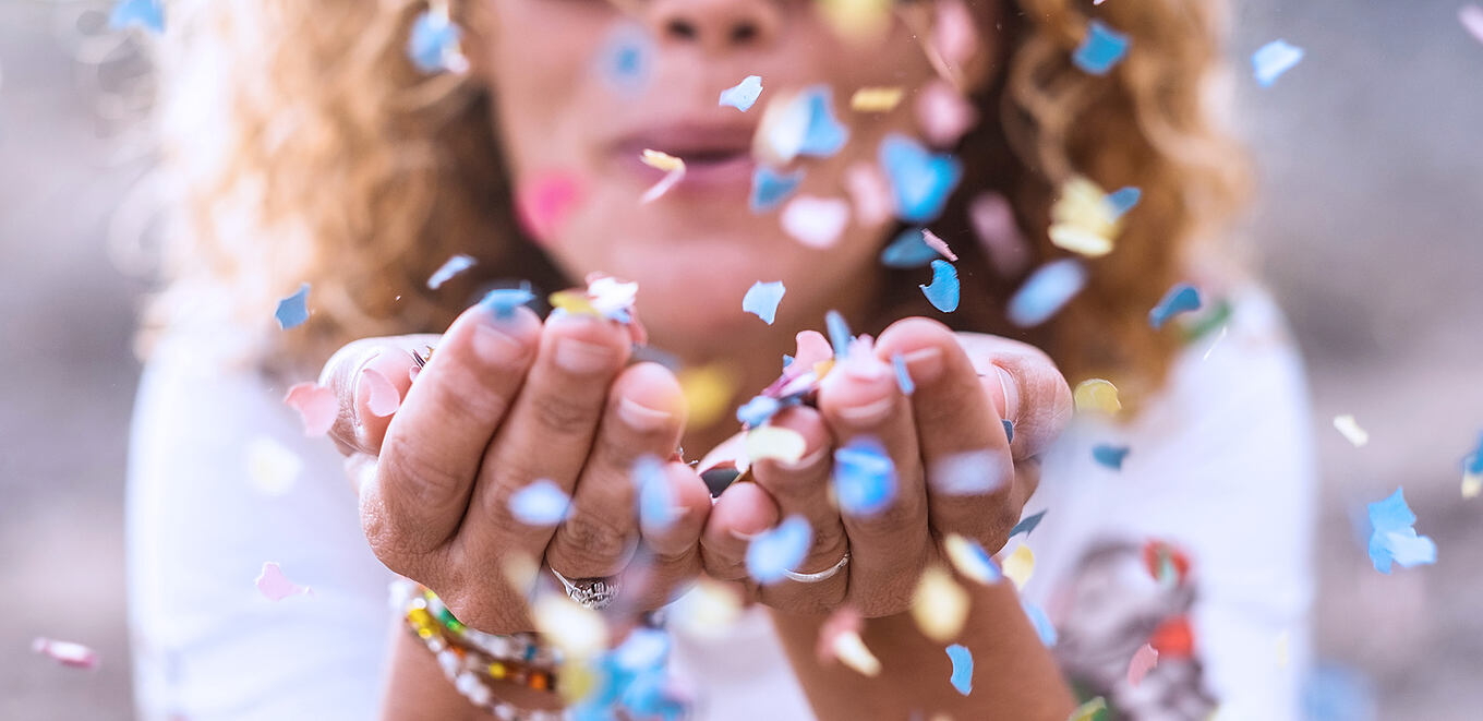 Beautiful,Defocused,Woman,Blow,Confetti,From,Hands.,Celebration,And,Event