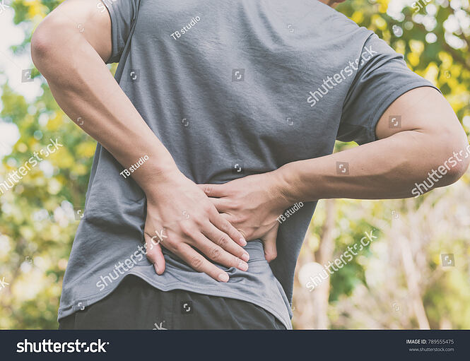 stock-photo-a-man-has-low-back-pain-789555475